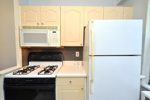 kitchen featuring white appliances, decorative backsplash, and light countertops