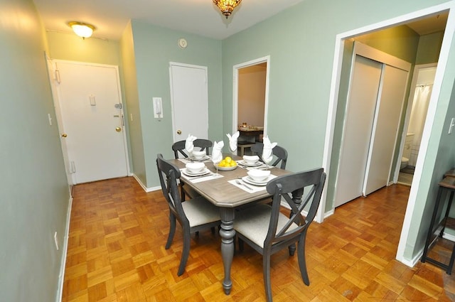 dining area featuring baseboards