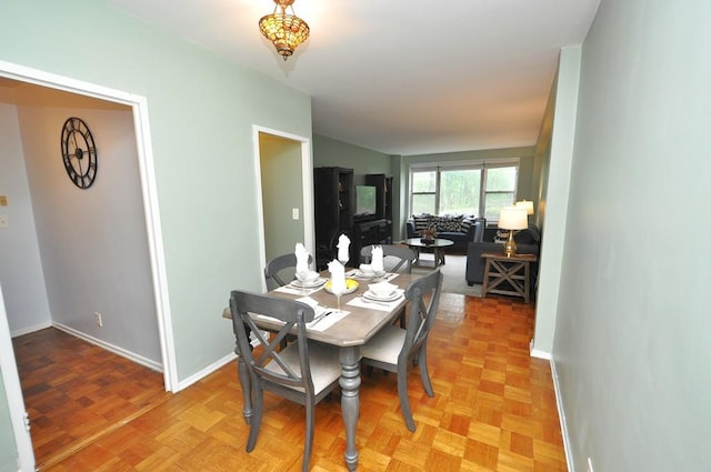 dining area featuring baseboards