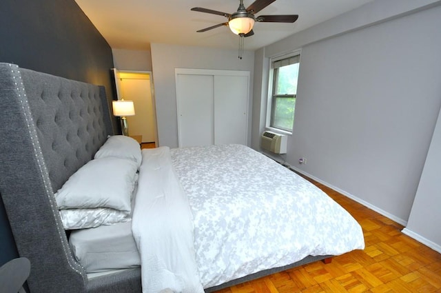 281 Garth Rd Unit A2K, Scarsdale, NY 10583 - bedroom with baseboards, a closet, a wall mounted air conditioner, and ceiling fan