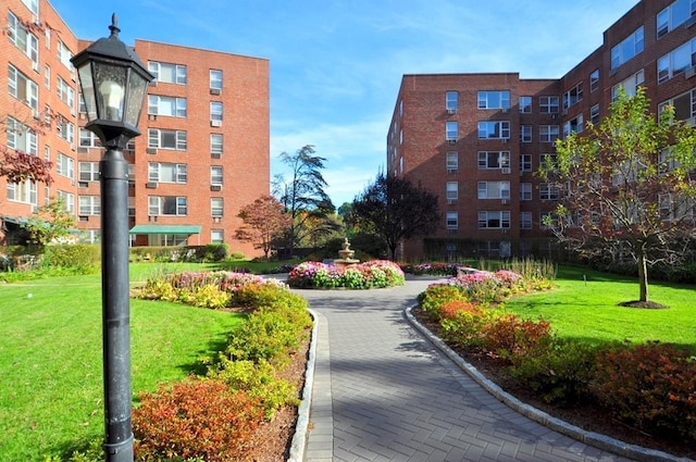 surrounding community featuring a yard