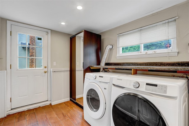 laundry room featuring separate washer and dryer, light wood finished floors, baseboards, and recessed lighting
