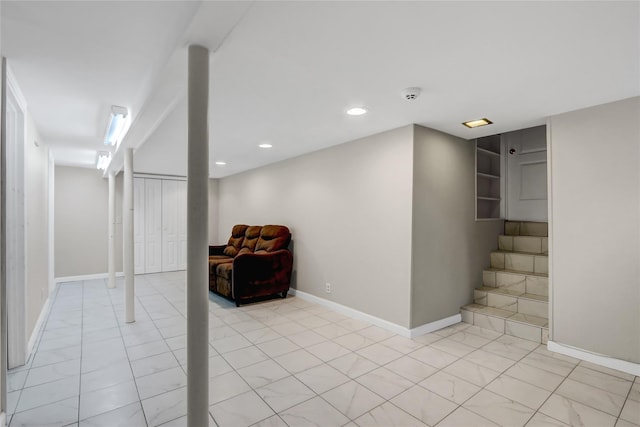 finished basement with stairway, baseboards, and recessed lighting