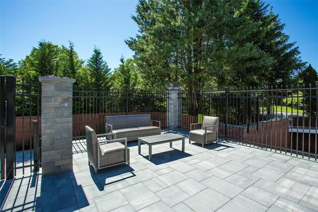 view of patio with an outdoor hangout area and fence