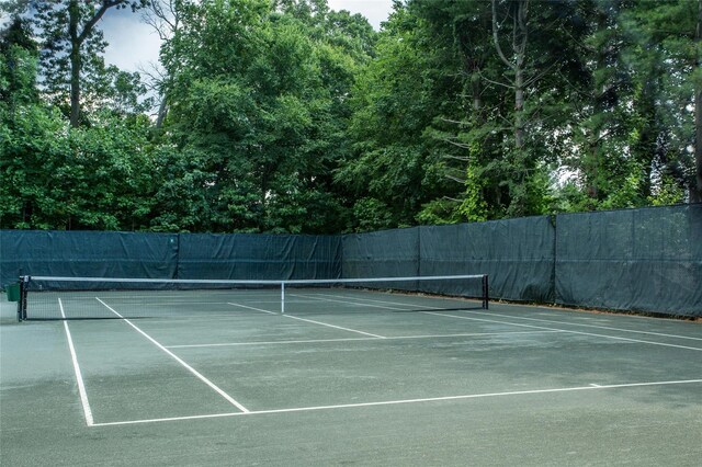 view of tennis court with fence