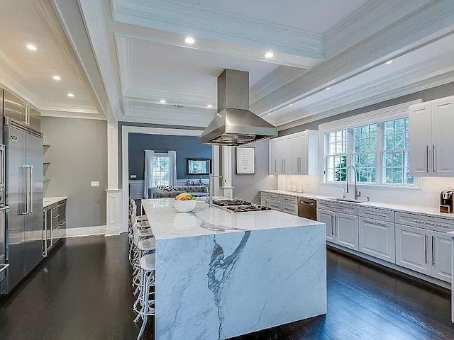 2 Short Path, Nissequogue, NY 11780 - kitchen featuring a sink, crown molding, island range hood, a kitchen island, and appliances with stainless steel finishes