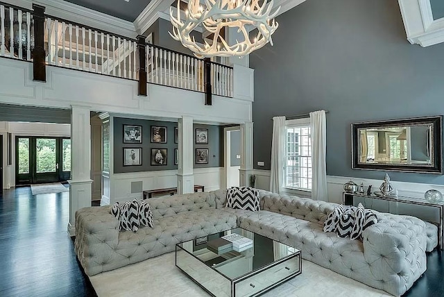 2 Short Path, Nissequogue, NY 11780 - living area featuring crown molding, a towering ceiling, ornate columns, and a healthy amount of sunlight