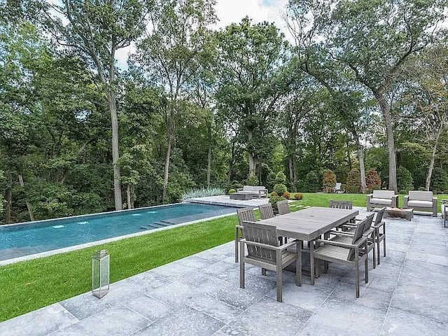 2 Short Path, Nissequogue, NY 11780 - view of patio with outdoor lounge area, outdoor dining space, and an outdoor pool