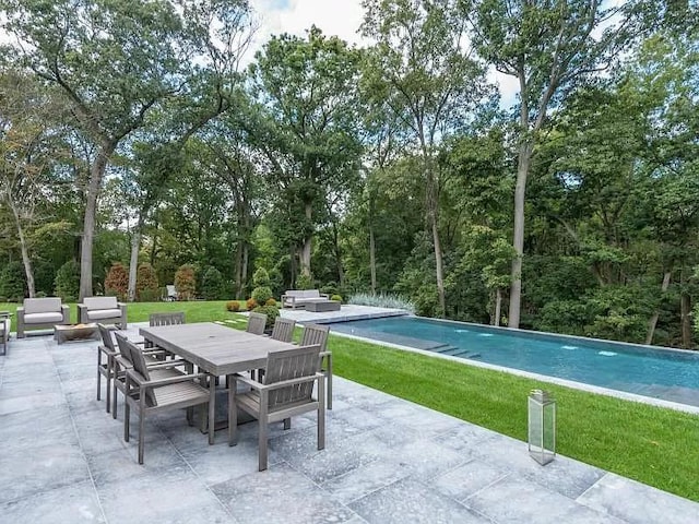 2 Short Path, Nissequogue, NY 11780 - view of patio / terrace featuring outdoor dining area, an outdoor pool, and an outdoor hangout area