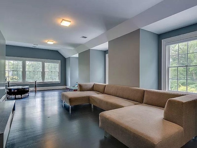 2 Short Path, Nissequogue, NY 11780 - living area with plenty of natural light, visible vents, baseboards, and lofted ceiling