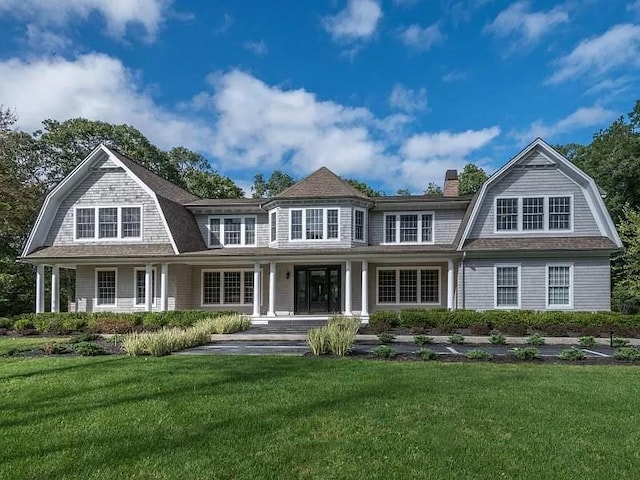 2 Short Path, Nissequogue, NY 11780 - exterior space featuring a yard, a chimney, a gambrel roof, and a porch