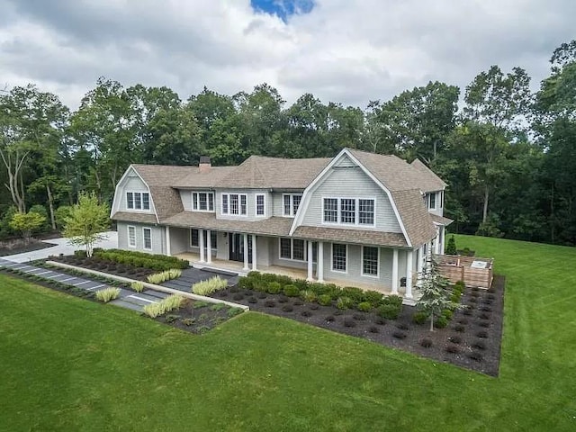 2 Short Path, Nissequogue, NY 11780 - view of front of home featuring a gambrel roof, a front yard, and roof with shingles