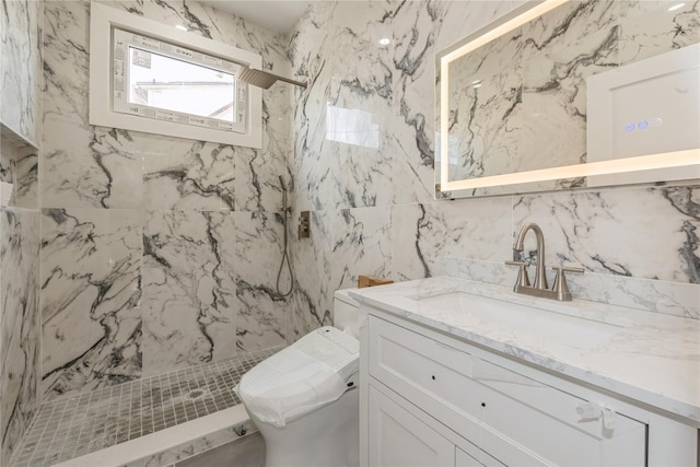 full bath featuring tile walls, toilet, a marble finish shower, and vanity
