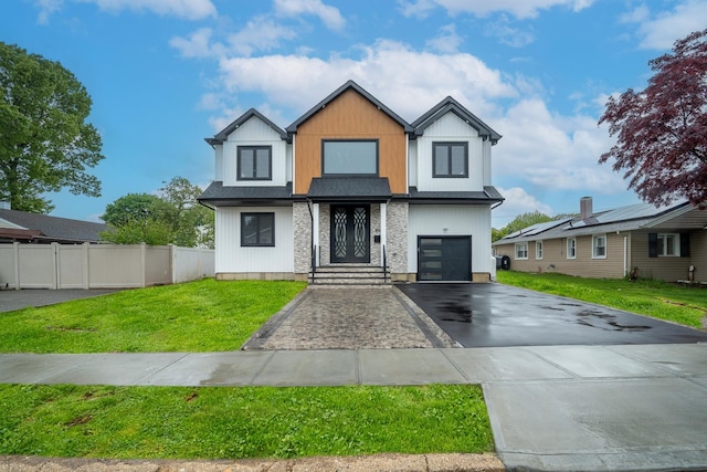396 Argyle Rd, East Meadow, NY 11554 - contemporary house featuring asphalt driveway and an attached garage