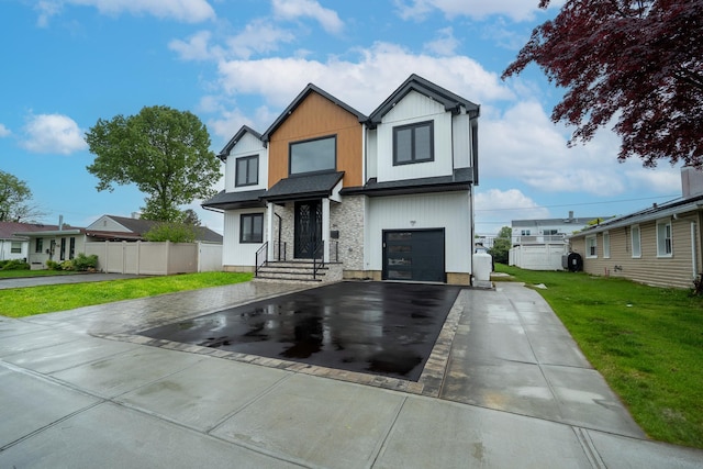 396 Argyle Rd, East Meadow, NY 11554 - contemporary home featuring driveway and a garage