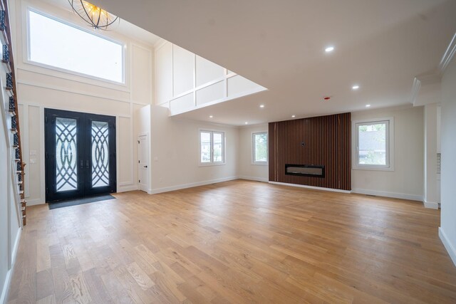 396 Argyle Rd, East Meadow, NY 11554 - entrance foyer with recessed lighting, plenty of natural light, light wood finished floors, baseboards, and crown molding