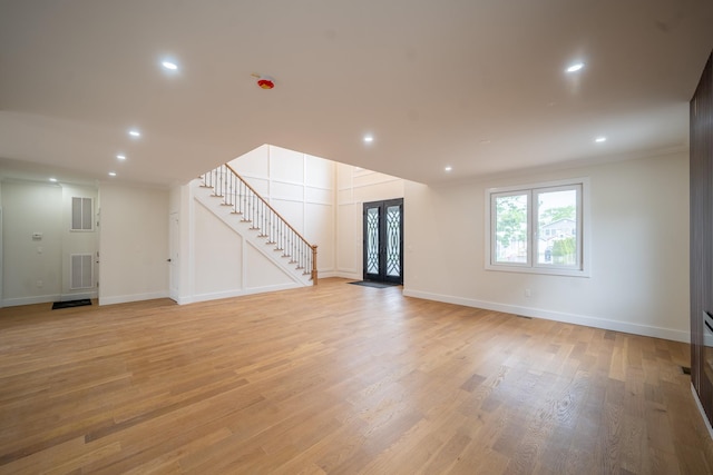 396 Argyle Rd, East Meadow, NY 11554 - basement with stairs, light wood-style floors, baseboards, recessed lighting, and ornamental molding