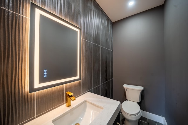 396 Argyle Rd, East Meadow, NY 11554 - bathroom with toilet, vanity, and tile patterned floors