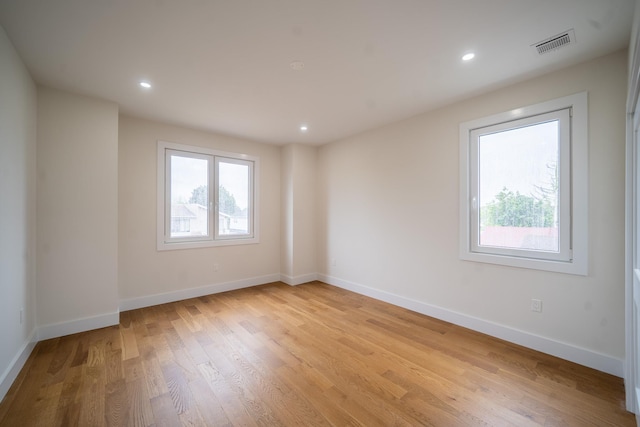 396 Argyle Rd, East Meadow, NY 11554 - empty room featuring plenty of natural light, light wood finished floors, baseboards, and recessed lighting