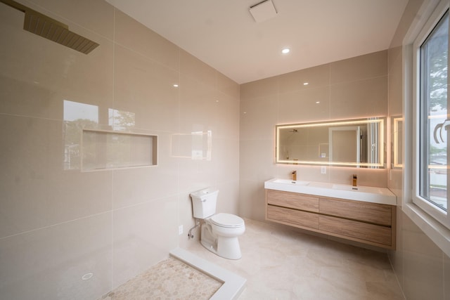 396 Argyle Rd, East Meadow, NY 11554 - full bathroom featuring tile walls, toilet, double vanity, tile patterned floors, and a shower