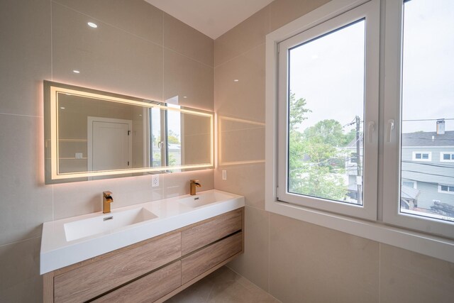 396 Argyle Rd, East Meadow, NY 11554 - bathroom with tile walls and double vanity