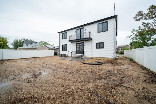 396 Argyle Rd, East Meadow, NY 11554 - rear view of property with a balcony and a fenced backyard