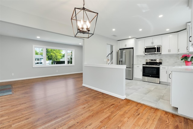 5 Helen Dr, Wappingers Falls, NY 12590 - kitchen featuring stainless steel appliances, open floor plan, backsplash, recessed lighting, and light countertops