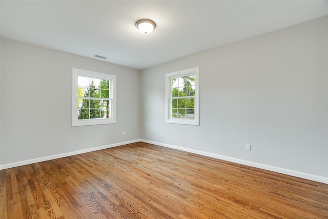 5 Helen Dr, Wappingers Falls, NY 12590 - empty room with plenty of natural light, wood finished floors, and baseboards
