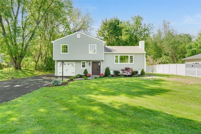 5 Helen Dr, Wappingers Falls, NY 12590 - split level home featuring driveway, a chimney, a garage, and roof with shingles
