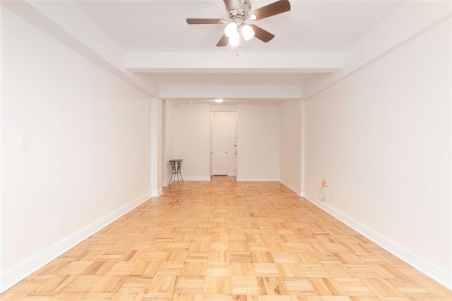 unfurnished room featuring baseboards and ceiling fan