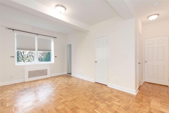 empty room featuring baseboards