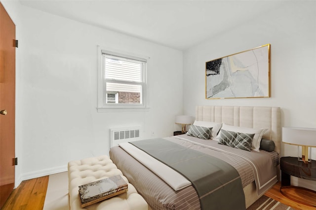 146-24 27th Ave, Flushing, NY 11354 - bedroom with radiator, wood finished floors, and baseboards