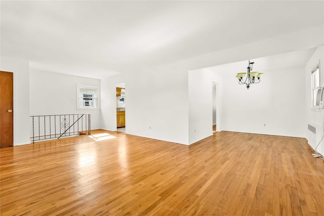 146-24 27th Ave, Flushing, NY 11354 - empty room with a chandelier, light wood-type flooring, and radiator