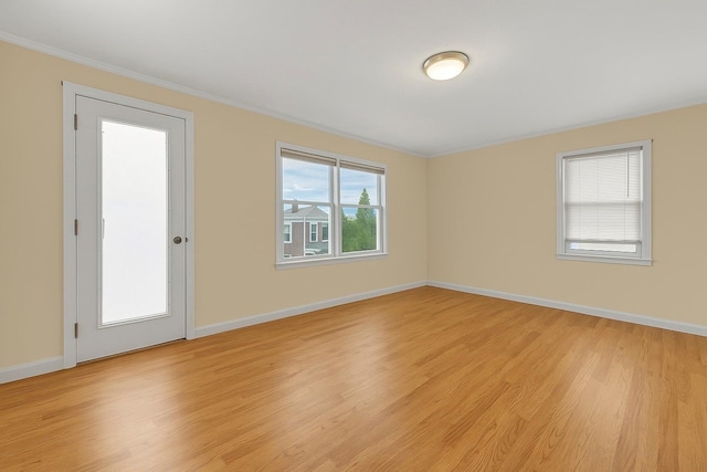 56 W Beech St, Long Beach, NY 11561 - spare room with light wood finished floors, crown molding, and baseboards