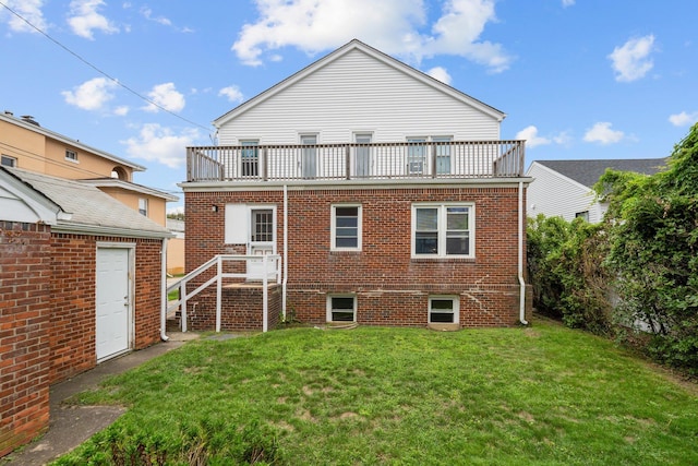 56 W Beech St, Long Beach, NY 11561 - rear view of property featuring a balcony, brick siding, and a lawn