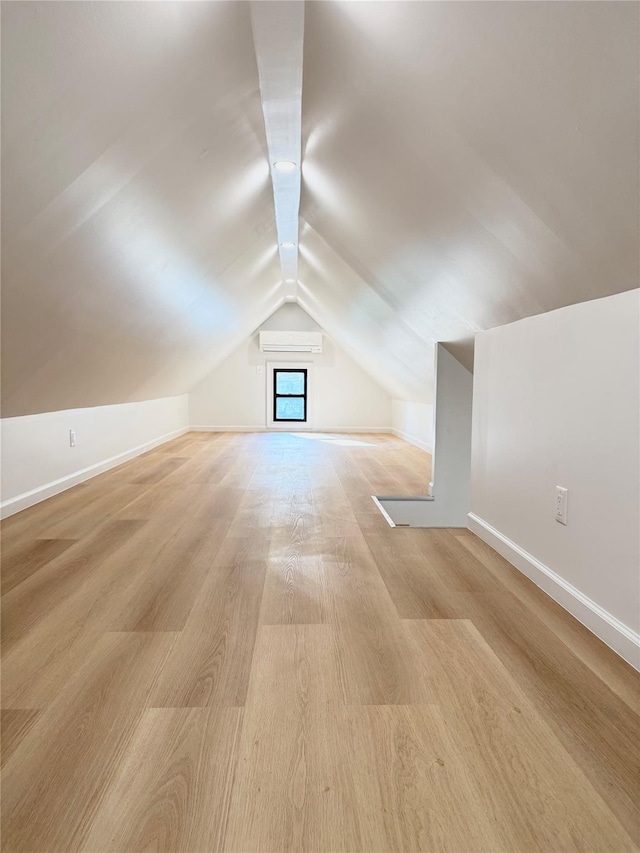 8831 69th Ave, Forest Hills, NY 11375 - additional living space featuring vaulted ceiling, baseboards, and light wood finished floors