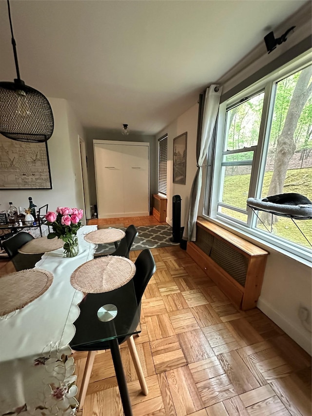 dining space featuring baseboards
