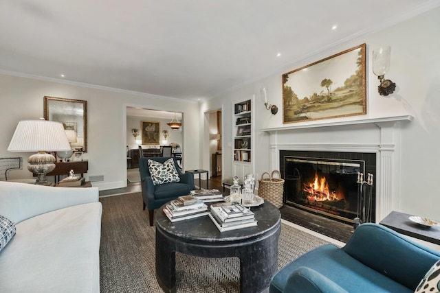 35 Brooke Ave, Bronxville, NY 10708 - living room featuring a fireplace with flush hearth, ornamental molding, wood finished floors, built in features, and recessed lighting