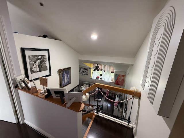 stairway featuring recessed lighting, ceiling fan, vaulted ceiling, and wood finished floors