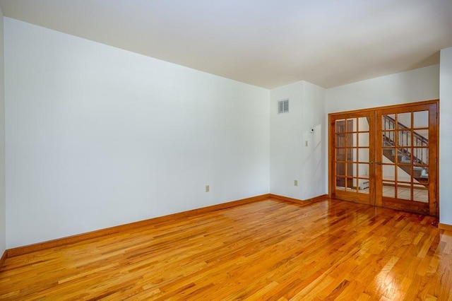 253 W Main St, Stony Point, NY 10980 - empty room with light wood-style flooring, baseboards, and french doors
