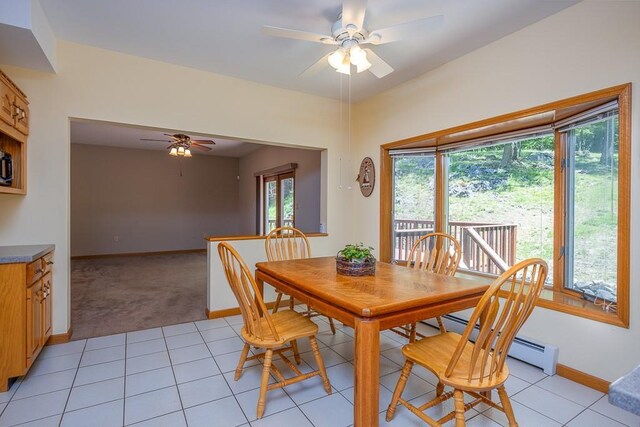 253 W Main St, Stony Point, NY 10980 - dining space featuring a ceiling fan, baseboards, light tile patterned flooring, light colored carpet, and baseboard heating