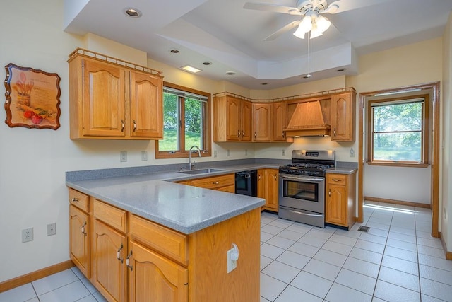 253 W Main St, Stony Point, NY 10980 - kitchen with stainless steel range with gas cooktop, custom exhaust hood, a sink, a peninsula, and healthy amount of natural light