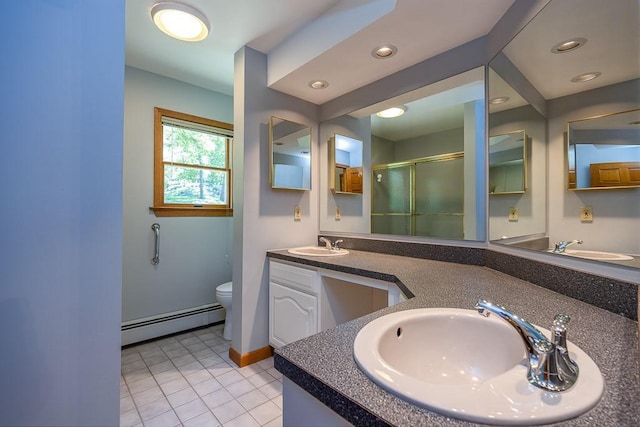 253 W Main St, Stony Point, NY 10980 - full bathroom featuring a baseboard radiator, a stall shower, double vanity, toilet, and tile patterned flooring