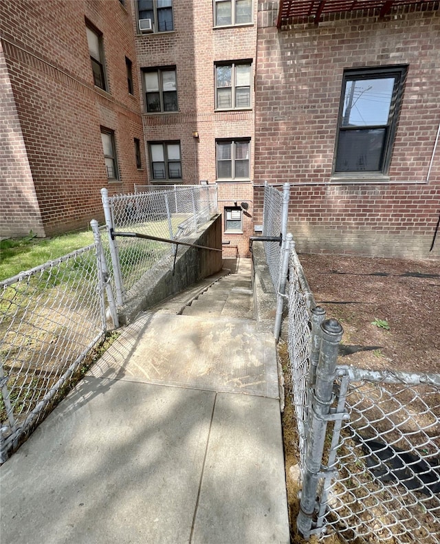 745 E 231st St Unit 1F, Bronx, NY 10466 - view of home's exterior with brick siding and fence