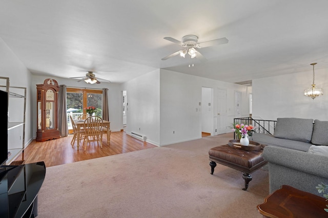 1 Red Fox Ln, Brewster, NY 10509 - carpeted living area featuring a ceiling fan, baseboard heating, baseboards, and wood finished floors