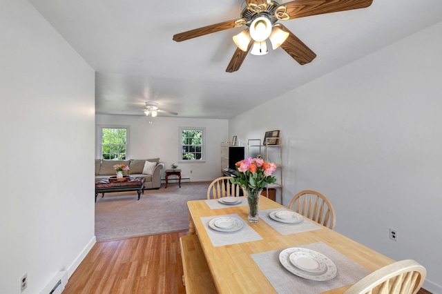 1 Red Fox Ln, Brewster, NY 10509 - dining room featuring ceiling fan, light wood finished floors, a baseboard radiator, baseboards, and baseboard heating