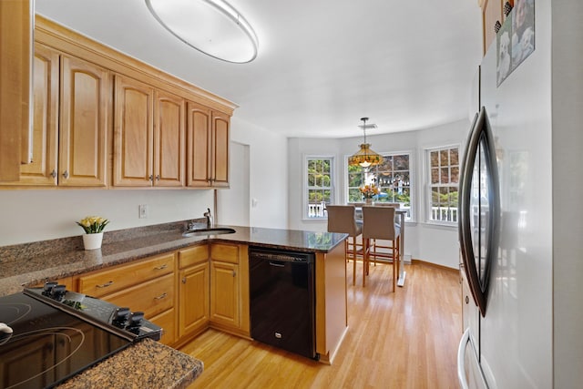 1 Red Fox Ln, Brewster, NY 10509 - kitchen featuring freestanding refrigerator, dishwasher, a sink, light wood-type flooring, and a peninsula