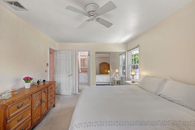 1 Red Fox Ln, Brewster, NY 10509 - bedroom featuring light colored carpet, connected bathroom, and a ceiling fan