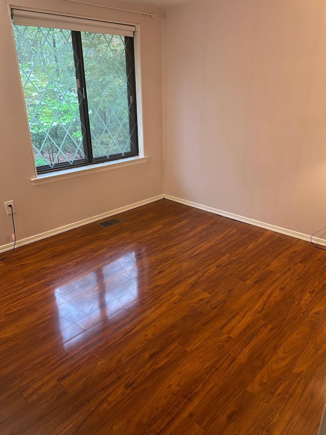 118 Skyline Dr, Coram, NY 11727 - spare room with baseboards and dark wood-style floors