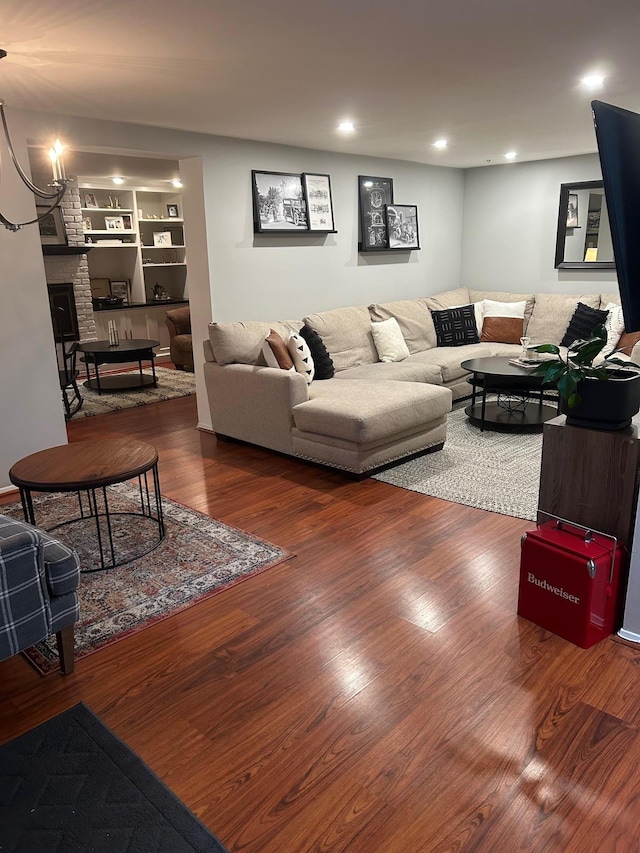 118 Skyline Dr, Coram, NY 11727 - living area featuring wood finished floors, a fireplace, and recessed lighting